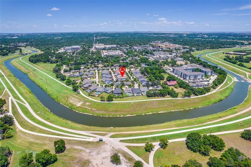 Upgrades Galore in this 2 Story Townhome in the Desirable Gated River Heights Community! Enjoy direct access to the Trinity Trails only minutes from Downtown! Each bed has its own private bath. The custom wood door with iron treatment welcomes you into this Village Home with wood-like tile throughout. Downstairs, find all entertainment space, including a grand kitchen with 3 inch leathered granite countertops, a gas stove, built in microwave, stainless whirlpool appliances, walk in pantry and a shuttered window wall looking onto the mature landscape. The spacious living room has a built-in bookshelf, gas start exposed brick fireplace, and additional flex space perfect for a sitting area. The beautiful French Doors lead to the 17x12 open patio with built in tv case and hot tub pad. The half bath down with pedastal sink is perfect for guest access. Don't miss the study nook and mud room with built in bookcase, granite countertop & custom hardware. Upstairs find all beds, the utility room and an additional 18x7 loft space that could serve as a second office, playroom or quiet retreat. The primary ensuite has custom window treatments, a cedar closet, walk in shower w bench & a leathered dual sink vanity with custom tile. The secondary beds are large with spacious closets and each have their own ensuite bath, one with a shower tub combo and one with a walk-in shower. Walk to the River District Peninsula shops, enjoy the private community pavilion & park, run or bike along the trails and attend neighborhood events!