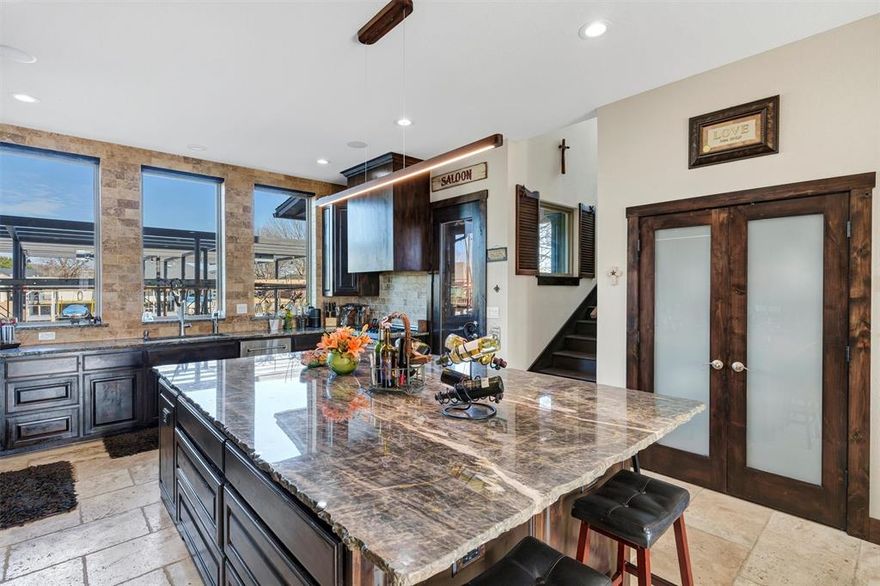 VRBO's allowed!! AND You will NOT be disappointed! Unmatched Lakefront Luxury A True Dream Home w so many upgrades where no expense was spared in the making of this beautiful ULTIMATE LAKE FRONT Paradise! Don't walk an acre to get to get to your boat, sea doo slips, & fish! Just walk right outside your back door where you can BBQ in your outdoor kitchen, sit & enjoy the sunshine, or hop on your boat in 2.5 seconds & view the MOST GORGEOUS VIEW on Lake Granbury and YES the Dock is completely finished and upstairs can be added! Stunning Lake Granbury home is the epitome of lakeside living! DOCK FEATURES double Sea-Doo slip & a LRG BOAT SLIP, ideal for all your wtr activities. Lounging & fishing areas is the perfect spots to unwind & enjoy the serene views and lots of fishing! Every detail of this home has been meticulously designed with HGTV-level upgrades, where no spectacular ideas were spared in creating an exceptional TEXAS lakeside retreat. From the breathtaking views to the exquisite finishes, this home is nothing short of wonderful. We have let the natural light shine thru w 37 windows & 5 full light solid wood knotty Alder doors, 27 speakers inside & out with surround sound that will knock your socks off! VERY high-end Quartzite w chiseled edge finish, 119 X 92 inch Island, Tons of storage, Cappuccino bar, full bar & kitchen upstairs boast kegerator, double sink microwave, fireplace, & pool table area! Fully foamed from top to bottom, 4 bathrooms! a fully decked attic, 3 patios, gorgeous Onyx blk architectural shingles, lots of beautiful woodwork including stan grade solid wood knotty alder cabinets thruout, French drains, bronze gutters & more! Come see for yourself why this lakefront property is the ultimate in luxury living & put together with extra care for you, all of your family & friends to enjoy. Once you walk in the door you will be sold! GREAT NEIGHBORHOOD!! AND THE MOST gorgeous view on lake Granbury TX that comes with a GORGEOUS home!