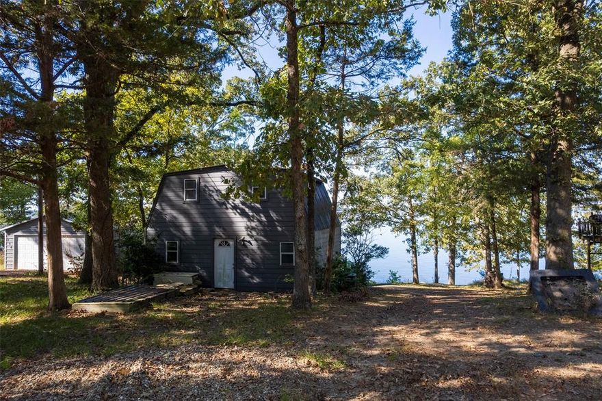 Waterfront opportunity on Lake Bob Sandlin! This tree-shaded lot in Thunderbird Point offers stunning main lake views and endless potential. A small home sits on the property and is being sold as-is, ready for renovation, rebuild, or a brand-new lake retreat. Ideal for those looking to invest, create a personal getaway, or build a future Airbnb or VRBO. Don’t miss the chance to own a piece of prime lakefront! Home sold as-is. The seller has limited knowledge about the home. Subdivision information can be found on Thunderbird Point's website.