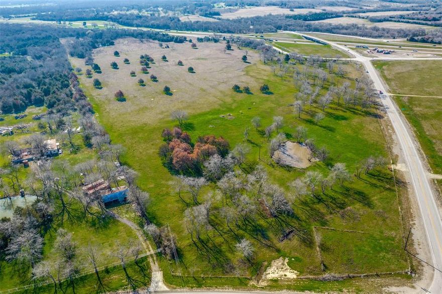 57 acres ideal for commercial or mixed-use development.  Sitting at the corner of FM 429 and I-20.  This property has 2,300 feet of frontage on the I-20 access road and 939 feet of frontage on FM 429.  This property is free of any pipelines or transmission lines.  The property has about three acres of floodplain in the southeast corner of the property.  There is a 10 inch water line that runs next to the property.  This property is outside the city limits of Terrell but is just a few minutes to downtown.  This property is great for investment or development.