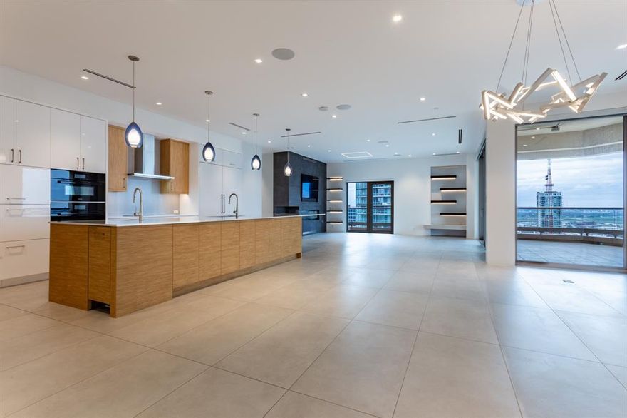 Bespoke Stoneleigh Residence designed by meticulous owners with an eye for quality & detail. This custom home features 10 ft ceilings, Fiandre Italian porcelain tile floors, a Sonos system, Starpower URC Audio Video Control System integrated with Lutron shade & lighting system. The direct-access elevator delivers you to a private vestibule adorned with book-matched Audacia honed Quartzite wall & served by a 4-foot-wide door to the service hallway, generous enough for the largest furniture to fit. The entry hall spills into a glorious open Kitchen-Dining Room-Living Room combination. A true gas fireplace on an impressive stone wall with a recessed TV delineates the Living Room which boasts access to 2 balconies, one of which has a full-wall stacker sliding door integrating a large corner balcony. The Dining area is flexible enough to fit any size table, has a china-silver closet & is illuminated by a designer pendant. And, OH!, the Kitchen! Even the most experienced chef would be impressed with the grandeur & functionality of this fully equipped Kitchen which has it all: 16 ft island with breakfast bar, Dekton Stone counters & backsplash, a coffee bar, Miele  oven + microwave-Speed Oven, warming drawer, induction cooktop, dishwasher, 60-inch refrigerator-freezer + 2 Sub Zero refrigerator drawers. The Primary Suite features 2 Chanel Boutique-worthy closets & a Dekton Stone spa-like Bath sporting a free-standing soaking tub, luxurious shower, separate vanities, lighted mirrors with storage & a laundry room with sink. Guests enjoy a split Suite & gorgeous stone Bath. 5-star Hotel amenities include concierge, valet, club room, banquet room, catering kitchen, board rooms, fully equipped fitness center & locker rooms with sauna & steam, resort-style pool & spa, outdoor fireplaces, grills & a pet park. Fashionable walkable Uptown has myriads of restaurants, shopping & entertainment venues. Convenient to Klyde Warren Park, Arts District, Design District, Victory Park & CBD.