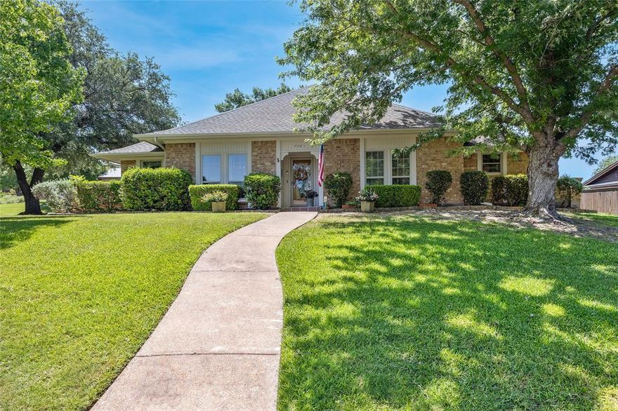 Beautifully Maintained One-Owner Home on Large Corner Lot Backing to Greenbelt

This thoughtfully updated single-story home sits on a spacious corner lot with no rear neighbors, backing to a scenic greenbelt. Step into a welcoming foyer that opens to a spacious living room featuring a large brick fireplace, wet bar, and French doors leading to a serene slate-tiled 19 x 24 courtyard—partially covered and ideal for entertaining.

The formal dining room showcases wood flooring and a built-in buffet, while the updated kitchen boasts a garden window, travertine flooring, solid surface countertops, double ovens, a large island, and breakfast bar. The kitchen opens seamlessly to both the family room and breakfast area, with additional access to the courtyard from the family room.

The primary suite offers ample space for a sitting area, and the ensuite bath includes double sinks, a soaking tub, and a separate shower with body spray jets and double walk-in closets. Two of the secondary bedrooms share a full bath. All wet areas feature travertine flooring, while bedrooms are comfortably carpeted.

Located in a vibrant lakeside community with amenities including a boat ramp, pickleball courts, playground, greenbelts, and a waterfront park with year-round activities, this home offers the perfect blend of comfort, character, and lifestyle.

Updates:  Appliances 2022, Roof 2022, Water heater 2022, HVAC 2022, windows about 14 replaced 2022, others replaced 2005, Family room carpet 2024, Bedroom carpet 2022

Seller will need about 1 week leaseback after closing and funding. Seller will not look at any offers that have seller financing, or subject to financing. No blind offers. Buyers to purchase new survey. Sellers to retain gas and mineral rights
