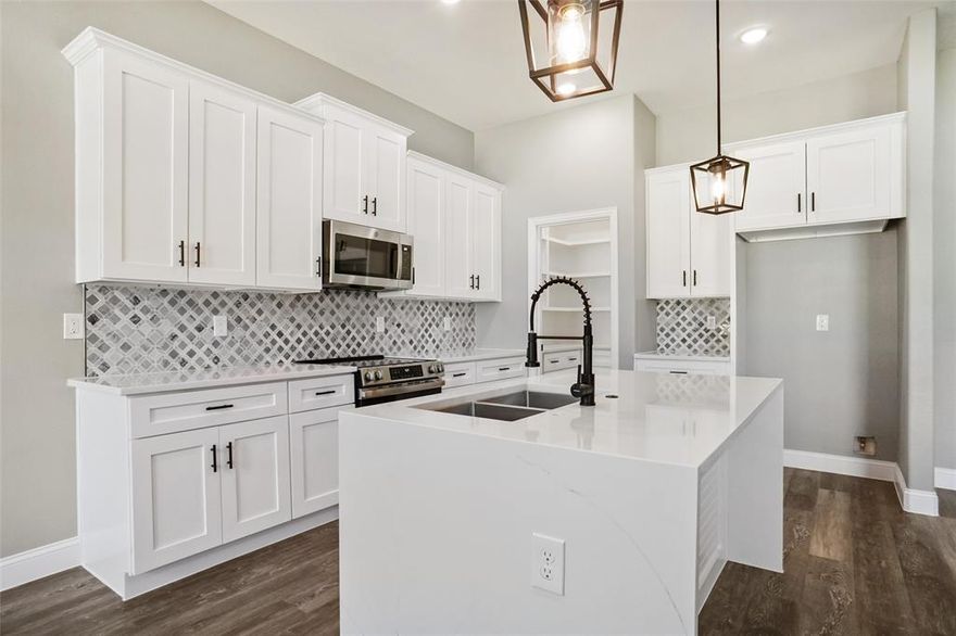 GATED & GUARDED COMMUNITY*NEW CONSTRUCTION BY BLUE RIBBON HOMES*2 POOLS*2 TENNIS COURTS*CLUBHOUSE*2 BOAT RAMPS*ACCESS TO LAKE GRANBURY*SWIMMING, BOATING & FISHING*1-STORYBEAUTY*LARGE BACKYARD W-COVERED PATIO*LOT IS 60 X 119, APPROX  .158 acre lot*WOODED LOT*FENCED*CITY WATER & SEPTIC *QUALITY CONSTRUCTION*QUARTZ COUNTERS*KITCHEN W-WATERFALL ISLAND, GE APPLIANCES, RECYCLE DRAWER, COFFEE BAR, WALK-IN PANTRY W-STORAGE & SHELVING*4-BURNER ELECTRIC RANGE*42-INCH WHITE CABINETRY W-BLACK PULLS*STAINLESS SINK*LAUNDRY ROOM W-QUARTZ COUNTERS,SINK, ROOM FOR FREEZER*PROPELLER FANS & LUXURY WATERPROOF VINYL FLOORING-EDWARDOAK*LIVING W-REMOTE ELECTRIC FIREPLACE, STONE SURROUND & HEARTH*FIREPLACE CAN EMIT HEAT OR PROVIDE AMBIANCE*OPEN FLOOR PLAN*3 BED, 2.5 BATHS*LOVELY PRIMARY SUITE W-ELEGANT BATH,STAND-ALONE TUB, HUGE SHOWER W-FRAMELESS GLASS*OVERSIZED CLOSET*HOA $308 YR*2 CAR GARAGE W-SINGLE DOOR*ATTIC PULL-DOWN*CEILING FANS THROUGHOUT*SPECIAL FINANCING AVAILABLE* 5 PERCENT DOWN PAYMENT ASSISTANCE*YOU DO NOT HAVE TO BE A FIRST TIME HOMEBUYER* 6 AND ONE EIGHTH RATE PROGRAM AVAILALBE TOO*CALL FOR DETAILS*SEE 360 TOUR*