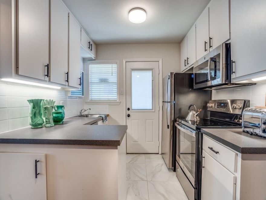 Adorable updated duplex in the heart of North Oak Cliff, just minutes from the vibrant Bishop Arts District. Both sides are being sold together — a rare opportunity for an owner-occupant or investor. Original hardwood floors gleam throughout, complemented by spacious rooms, abundant natural light, and fresh neutral tones for a light and airy feel. Each unit features an updated kitchen with stainless steel appliances, electric range, and built-in microwave. Bathrooms showcase designer flooring, pedestal sinks, elegant showers with overhead rainfall sprayers, and sleek frameless glass enclosures. Step outside to an incredible expansive Trex composite wraparound deck accented with cedar, creating the perfect space for entertaining. The backyard offers a wood privacy fence, detached two-car garage with additional storage, and ample grassy space for play or pets. HVAC 2022 & 2023, Water Heaters 2022, & Roof 2022