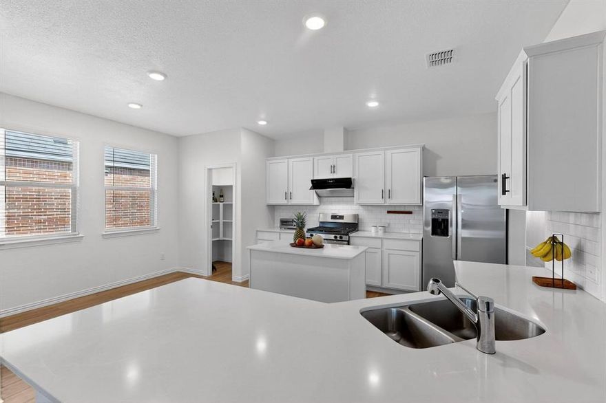 Welcome home to this gorgeous, single-level, turn-key 4 bedroom, 2 bathroom home conveniently located in the heart of McKinney!

Step inside and you’ll love the stylish LVP flooring throughout all living areas and bedrooms—no carpet in sight. The light and bright kitchen features an abundance of fresh white cabinetry, beautiful countertops, stainless steel appliances, and a large island that flows seamlessly into the living room, creating the perfect space for entertaining.

The spacious primary retreat offers a peaceful escape with a large walk-in closet, dual sinks, and a walk-in shower. Three additional bedrooms provide plenty of flexibility for family, guests, or a home office.

Enjoy the outdoors year-round on the covered back porch or in the oversized backyard, ideal for gatherings, play, or simply relaxing.