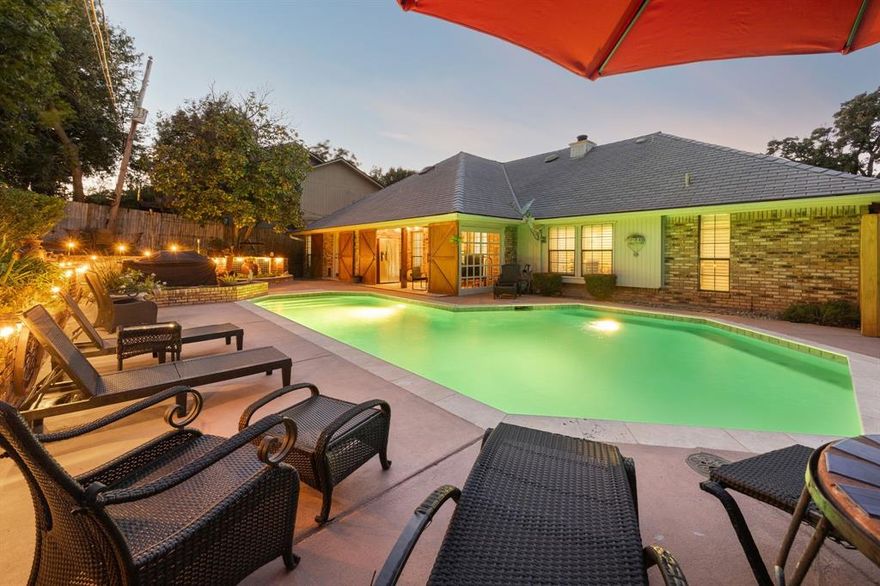 Location! Location! Location! Just minutes from Lake Arlington and nearby parks, this charming 3-bedroom, 2-bath home is brimming with character inside and out. Curb appeal shines with mature trees, a timeless brick exterior, and lush landscaping that sets the tone for what awaits inside. Step into the inviting living room, where a cozy fireplace creates a warm focal point and custom-built-in blends charm with practicality. At the heart of the home, the spacious kitchen offers a functional island, a unique stove alcove, generous cabinetry with stylish hardware, designer touches, and a sunlit breakfast nook. A formal dining room nearby sets the stage for memorable gatherings The impressive primary suite is a private retreat with a tray ceiling, French doors, and a spa-inspired ensuite boasting dual sinks, a soaking tub, and a separate shower. Spacious secondary bedrooms and a full bath offer comfort and flexibility for guests or a home office. Throughout, waterproof tile flooring adds both style and durability. Outside, discover your personal backyard oasis—complete with a sparkling pool, a large covered patio, and shady trees that create a peaceful backdrop. Whether swimming, dining al fresco, or relaxing poolside, this outdoor space is perfect for year-round enjoyment. With its prime location near Lake Arlington, parks, shopping, and dining—plus thoughtful updates throughout—this home is a true gem ready to welcome you home! Schedule your home tour today!