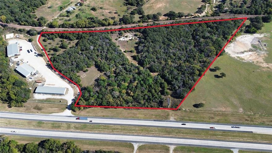 Located on the Highway 287 corridor, with more than 650 feet of road frontage and less than two miles from downtown Decatur, TX, this 17.75-acre parcel blends wooded seclusion with development potential, offering compelling opportunities for commercial, warehouse, or light industrial use. Currently operated as agricultural land, the property features mature timber that creates natural buffering, defines multiple building envelopes, and enhances site privacy while keeping easy access to town amenities. Its strategic position benefits from high visibility and quick connectivity to major transportation routes, supporting robust logistics and distribution opportunities. Utilities are readily accessible nearby, with proximity to power and communication lines to facilitate streamlined development. The gently rolling, wooded terrain provides versatile layout options, attractive drainage, and the potential for scenic, park-like staging areas alongside built environments. Nearby workforce hubs, expanding residential neighborhoods, and ongoing commercial growth bolster long-term value and demand. Environmental considerations are straightforward, with the woodlands offering natural sustainability advantages and potential incentives. Whether you’re envisioning a modern warehouse, a logistics hub, or a commercial campus, this property provides a clean, develop-ready canvas ready for thoughtful zoning, permitting, and partnerships. Don’t miss a rare chance to secure a premier, wooded, develop-ready site just moments from downtown Decatur in North Texas.