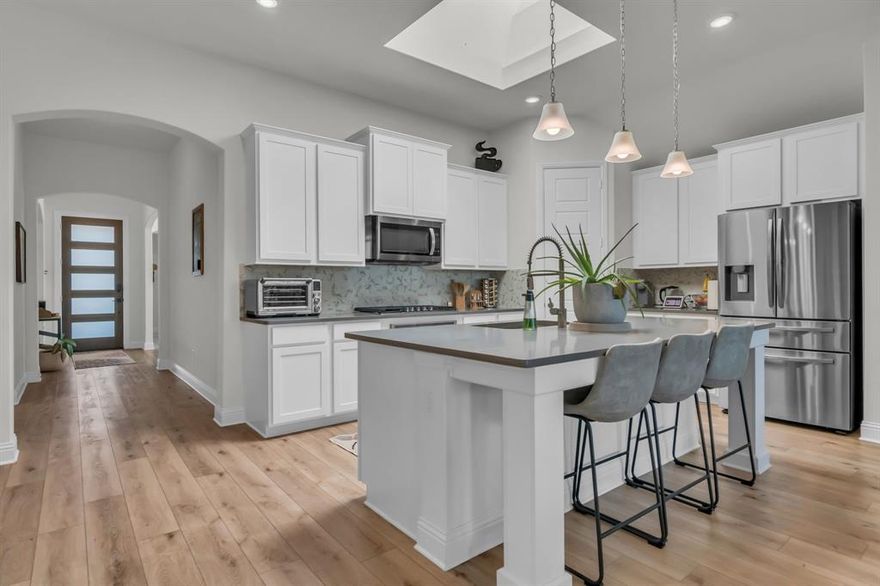 Corner lot, natural light, and walking distance to the lake! This 3 bedroom 2 bath home flows throughout, highlighted by a skylight that brightens the open layout. The primary suite includes a lovely bow window and spa-like en suite with garden tub and shower. Upgrades set this home apart—5-foot garage storage, a covered back patio with gas hookup, bow window in the primary bedroom, quartz countertops, and beautifully manicured front and back yards perfect for relaxing or entertaining. The study has all the right touches—an open floor plan with natural light that is a must see! Marine Creek Ranch in Fort Worth, TX offers close to lakeside living with private access to Marine Creek Reservoir , scenic trails that connect to the Trinity Trails system, a community park, pool, and playgrounds. Just minutes away, residents enjoy shopping and dining at Alliance Town Center, Hulen Mall, and local favorites like Boo Ray’s and Eggsquisite Café, with easy access to dog parks, the Fort Worth Nature Center, and multiple YMCA facilities. What are you waiting for? Schedule your showing today!