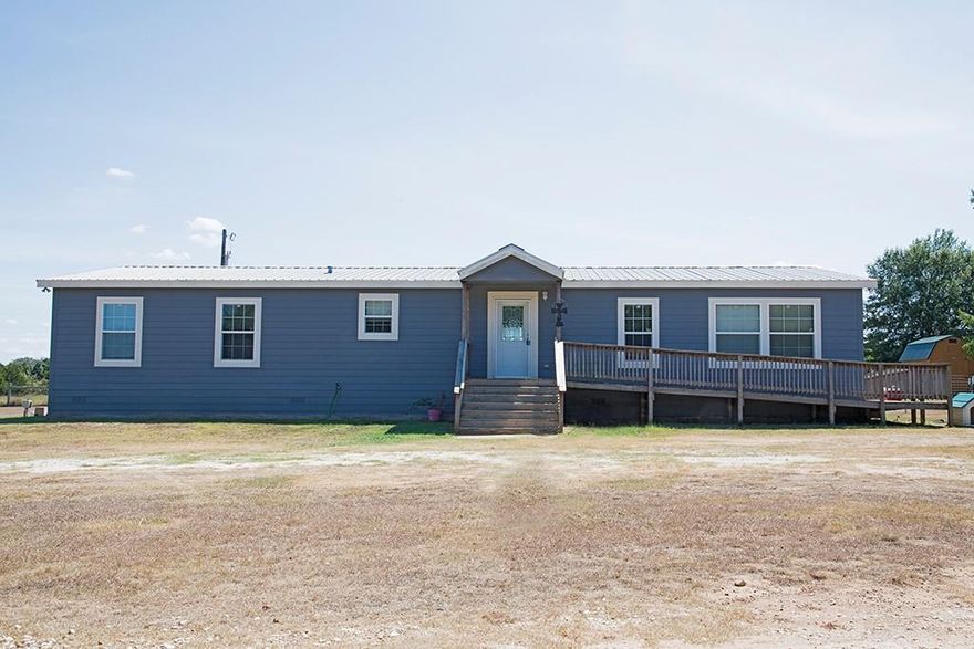 Very nice modular style, 4 BR/2BA home on 1 ac! If you're wanting to move to the country, then this property near Shiloh is a perfect starter home. On the outside it's nice and open with fenced area for pets or children to safely play.  You want a garden or a place for kids 4H projects?  You can have it!  On the inside, there's every feature that your family needs.  An open kitchen with an island, pantry, nice appliances and lots of cabinet space.  Large family room with wood burning fireplace.  And did we say FOUR bedrooms?  The Primary bedroom is privately situated away from the other bedrooms and offers a wonderful soaking tub, dual vanities and separate shower.  If you're working from home or home schooling kids, you'll really enjoy the office in this home.   Easily accessible from Mexia!  South on Hwy 39, left on LCR 437, property on the right, sign in the yard.