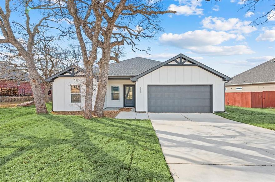 Charming 3-Bedroom Home in Desirable Runaway Bay a community known for its friendly atmosphere, scenic views, and proximity to outdoor activities. Whether you love boating, fishing, or simply enjoying nature, this home puts it all within reach.
Welcome to 217 Shady Oaks Drive, a beautiful and spacious 3-bedroom, 2-bathroom home located in the peaceful community. Situated in a quiet cul-de-sac, this home offers the perfect blend of comfort, convenience, and charm!
This home features generously sized bedrooms with plenty of natural light, offering a relaxing retreat for everyone in the family.
2 Full Bathrooms: Modern, well-appointed bathrooms with ample storage and stylish finishes.
Open-Concept Living: A bright and airy living room that flows seamlessly into the dining and kitchen areas, perfect for both entertaining and everyday living.
The kitchen boasts modern appliances, ample cabinet space, and a kitchen island—ideal for quick meals or casual dining

A two-car garage with additional storage space.

Quiet, Family-Friendly Neighborhood: Located just minutes from the scenic Lake Bridgeport, parks, and local amenities, Runaway Bay is an ideal location for those seeking a tranquil lifestyle with easy access to shopping, dining, and recreational activities.