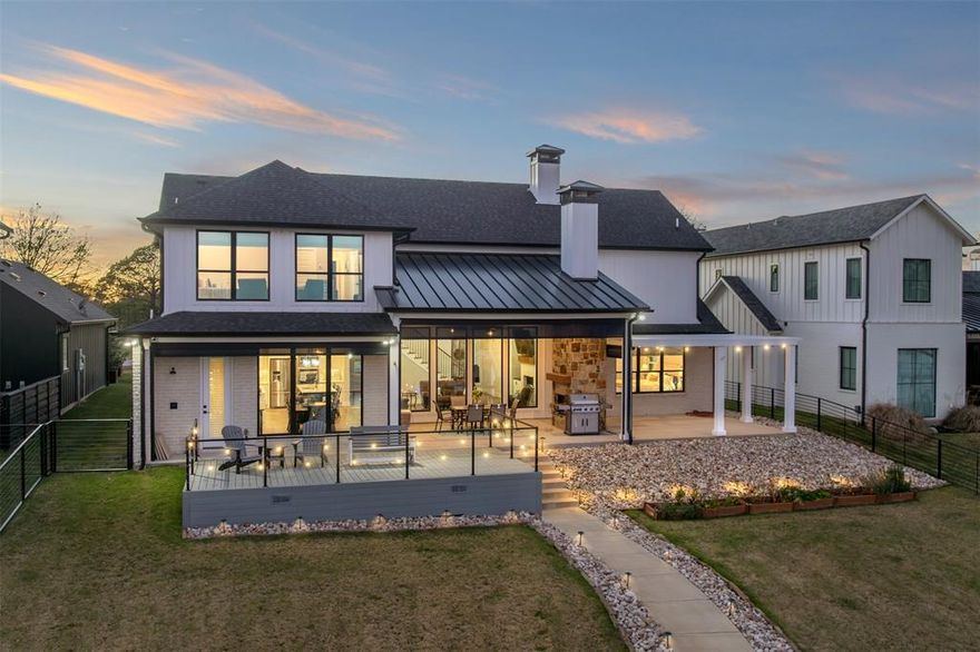 Luxury living on Cedar Creek Lake. This 5-bedroom, 3.1-bath home is ideally positioned at the mouth of the cove, facing southeast with expansive lake views and cooling southern breezes. Located in a private gated community of just ten waterfront homes, the property also benefits from an HOA-owned 8-acre parcel across the street, offering added privacy while remaining less than an hour from Dallas.

Inside, the living room showcases soaring ceilings with wood beams and a striking fireplace. The kitchen is designed for both everyday living and entertaining, featuring a large island, 5-burner gas cooktop, double ovens, pot filler, and an open layout ideal for gatherings. The ground-floor primary suite offers lake views, a walk-in shower with dual shower heads, and a spacious walk-in closet. One additional bedroom with an en suite bath is also located on the main level.

Outdoor living is enhanced by a large covered porch with an outdoor fireplace and remote-controlled retractable screens for year-round enjoyment. The fenced backyard is ideal for pets or play, and the boathouse includes a touchless remote-controlled boat cover, party deck, boat lift, and two personal watercraft lifts. Recent upgrades include a steel retaining wall completed in 2024, an electric vehicle charger with dedicated 40-amp service in the garage, spider misting system, expanded Google WiFi throughout the home and boathouse, Sonos speakers inside and at the boathouse, and a security system with cameras.

The fenced HOA parcel across the street includes a barndo for resident storage of boat trailers and recreational vehicles, with plans that may allow for a future 1-bedroom, 1-bath guest apartment. Contact listing agents for a full list of upgrades, furnishings, and personal watercraft available for separate purchase.