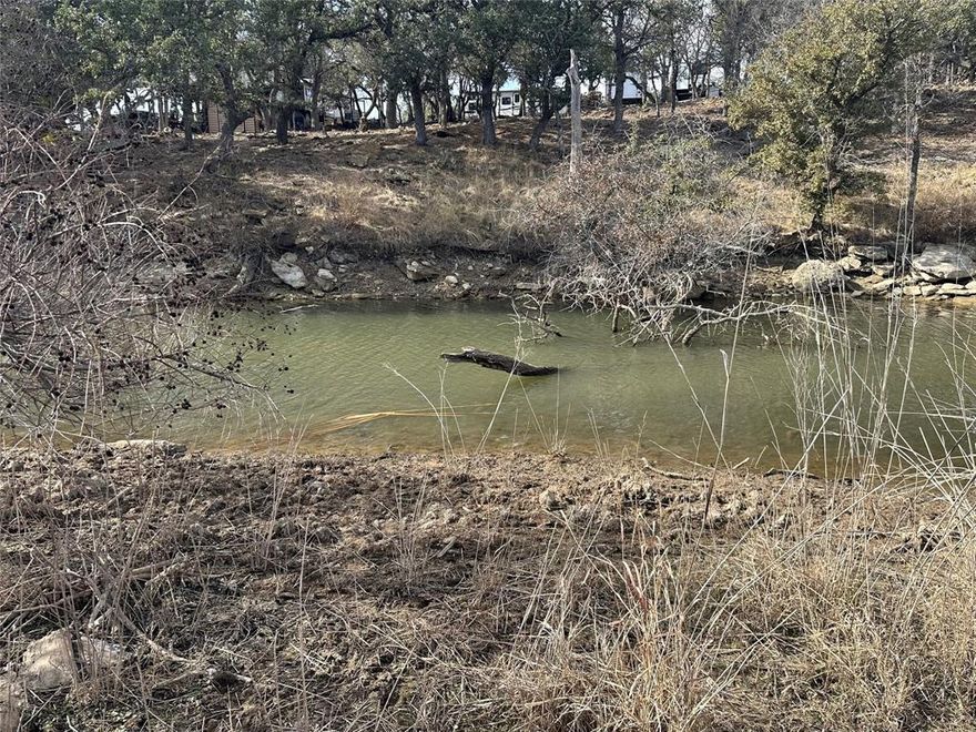 WATERFRONT LOT! Beautiful Lakefront property at Oak Point Subdivision.  Private Gated Community with an HOA that includes several parks and boat ramps. Electric at property.