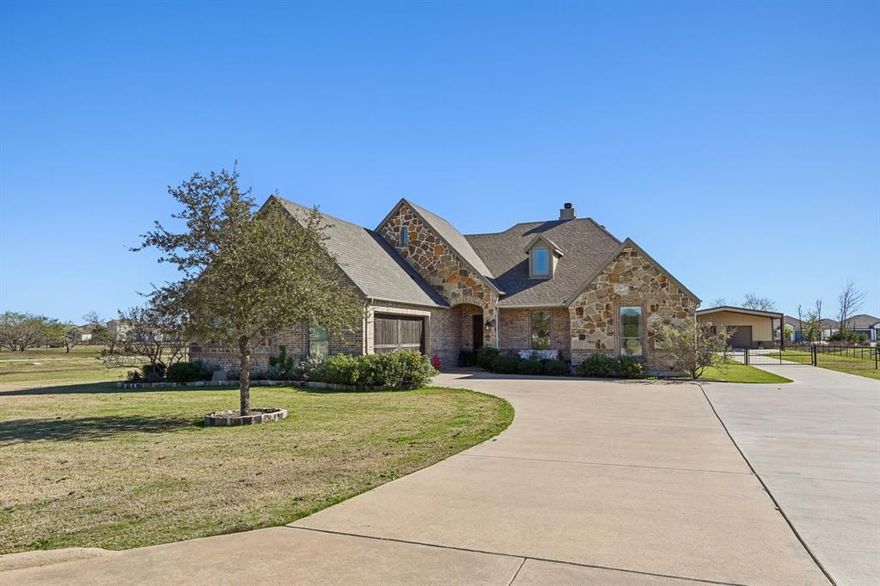 This AMAZING 1.7 acre property in a beautiful GATED community truly has it ALL — Luxury Living with a beautiful CUSTOM Single-Story home boasting hand-scraped hardwoods throughout the living areas. The popular open floorplan features an inviting Living Room with stone fireplace and beamed ceiling features with a view to the back from a wall of windows. The large Kitchen is complete with a breakfast bar, island with a prep sink, granite countertops plus a stunning archway with designer backsplash over the cooktop and Sub-Zero refrigerator. The Dining Dining Room features a built-in serving buffet and more country style views. The Master Retreat has separate vanities, garden tub, separate shower and WIC. Besides 2 additional bedrooms there is a private GUEST SUITE with full bath & WIC. That’s not all! A 1600 sq ft Shop with epoxy-coated flooring, 220 amp electricity, spray-foam insulation, restroom, AC split unit, 40 ft storage loft, large lift, steel cabinetry, 4 roll-up doors front & back, front carport for additional covered parking a and side overhang plus an extra pad in back – Perfect for car lovers or hobbyists. The concrete driveway stretches from the street all the way to the Shop. This property is a rare find!! More details on the Shop are available in the Transaction Desk.