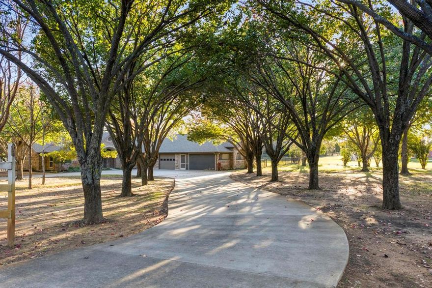 JUST REDUCED! This almost 3 acre ranch with a circular drive has so much to offer! 4 bedrooms, 3 full baths, one with a steam shower. Bedrooms have built ins and one has a cedar closet. Oversized primary bedroom with views of the pond. Updates to the kitchen, baths and floors since 2020. Heated floors in 2 baths. New carpet in 2 bedrooms in 2026. Large utility room with sink and room for second fridge. New roof in 2024. Shared stocked pond with lighted fountain and your own private dock! Recently fenced in area for your fur babies, your own chipping and putting green, workshop in garage with storage galore and an electronic screened in carport with TV for entertaining or use for as a carport. Aerobic Septic, private well for sprinklers and city water for the home. Don't miss this unique property in close proximity to Argyle, Flower Mound and Denton. Make an Offer!