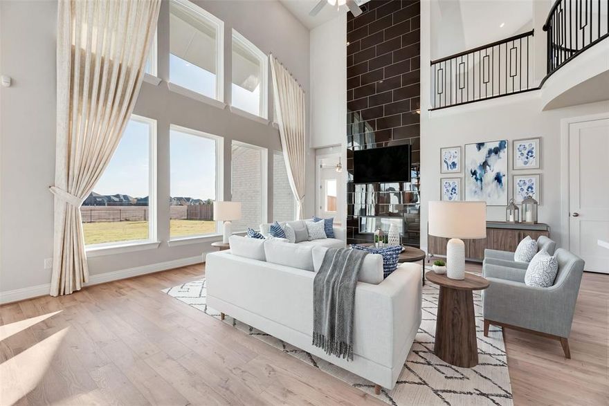 Introducing a new Grand Home in Park Trails, ideally located across from Opportunity Central. Residents enjoy access to a community pool and scenic walking trails, with all local schools within walking or biking distance. This beautifully designed Modern Farmhouse floor plan sits on .37 acre and has a 3 car garage. The home features a dramatic vaulted family room with a striking two-story modern fireplace and pre-wired flat screen TV outlet. Rich wood flooring extends through the entry, family room, home office, primary retreat, kitchen, and dining area, creating a warm and elegant feel. The chef’s kitchen, features Shaker-style cabinetry, Omegastone slab countertops, a five-burner gas cooktop, built-in stainless appliances, large island, walk-in pantry, and a spice drawer and trash drawer. A full oak staircase with contemporary wrought iron balusters adds a sophisticated touch. The first floor includes a home office and living area perfect for entertaining, along with a guest suite. Thoughtful upgrades include double front doors, eight-foot interior doors on the main level, extensive moldings, rocker switches, and decorative lighting throughout. The primary bath offers a luxurious retreat with a freestanding soaking tub, large frameless glass shower, and a huge closet. Upstairs, a spacious game room provides an ideal area for kids or recreation, a Media Room and a Bonus Room for the kids play area or a gym. There is also a large laundry room. This Energy Star certified home features R38 insulation, a radiant barrier roof, and energy-efficient vinyl windows. This is luxury living with convenience and style in one of the area's most sought-after neighborhoods.