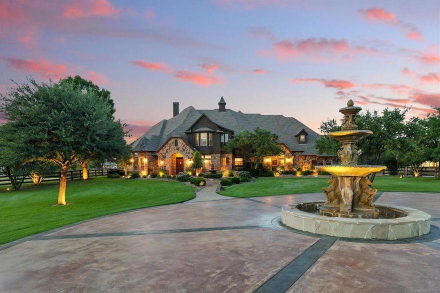 Welcome to your dream estate, nestled behind a gated entrance on 6.8 beautifully maintained AG-exempt acres. This one-of-a-kind property blends refined luxury with country living, offering the ultimate in privacy, comfort, and functionality. Step inside to discover rich hickory scraped wood floors, 4 spacious bedrooms, 7 bathrooms, a spacious office with custom cabinets, and a dedicated hobby room complete with a cozy fireplace.  The gourmet kitchen is a chef’s dream with an open layout that flows seamlessly into the main living areas. Entertain with ease thanks to a full wet bar equipped with a wine fridge and built-in ice maker, and a whole-home surround sound system that sets the perfect mood. The luxurious primary suite includes an updated spa-style shower and his and her closets, while the upstairs game room with a full bar and media room with a 3D projector and private bathroom provide endless entertainment. Step out onto the balcony for elevated views of your serene surroundings. Step outside to an entertainer's paradise: a heated saltwater pool with spa, an outdoor shower, and a large covered patio boasting a built-in kitchen and fireplace, ideal for year-round gatherings. Equestrian and hobby enthusiasts will appreciate the 66x42 horse barn with 6 custom stalls, tack room and wash rack, as well as the 40x60 fully insulated metal workshop with electric—perfect for any project. A fully stocked pond with an aerating fountain adds natural beauty, while the 750-ft deep well with a powerful 2-stage 5 HP pump to keep your pond and barn troughs full at all times. An R5 tornado shelter provides peace of mind. This estate offers a rare opportunity to enjoy upscale living with agricultural advantages— in highly rated Argyle ISD and just a short drive from city amenities. Don’t miss your chance to own this extraordinary retreat.