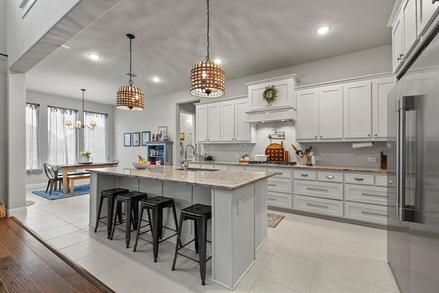 Beautifully designed home in sought-after Rockwall featuring an open, light-filled floor plan with high ceilings and elegant architectural details throughout. The chef’s kitchen is equipped with a built-in refrigerator, expansive island, and abundant cabinetry, flowing seamlessly into spacious living areas ideal for everyday living and entertaining. The primary suite offers a private retreat, while additional bedrooms and flexible spaces provide room to grow. Enjoy a covered patio and generous backyard that backs up to a walking trail in a prime location near shopping, dining, and top-rated schools.