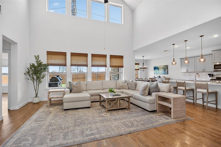 Welcome to this beautifully designed home located in the highly sought after Northwest ISD. With a spacious and functional layout, this home offers the perfect blend of style, comfort, and everyday livability. Step inside to soaring ceilings, abundant natural light, and an open concept living space that feels bright, airy, and inviting. Rich wood flooring flows through the main living areas, while the expansive family room opens seamlessly to a stunning kitchen featuring quartz countertops, gray shaker cabinetry, stainless steel appliances, a gas range, oversized island with seating, and designer pendant lighting. The private primary suite is a true retreat with generous space, large windows, and a spa inspired ensuite bath complete with dual vanities with a glass enclosed shower and a walk in closet. Secondary bedrooms are well sized and thoughtfully positioned, while the upstairs game room offers incredible flexibility for a media room, playroom, or second living area.

Out back, enjoy a covered patio built for relaxing and entertaining, complete with an outdoor kitchen and plenty of space to gather with family and friends. From the charming curb appeal to the modern finishes throughout, this home checks all the boxes. Located in desirable Northwest ISD with convenient access to shopping, dining, and major thoroughfares, this is one you do not want to miss.