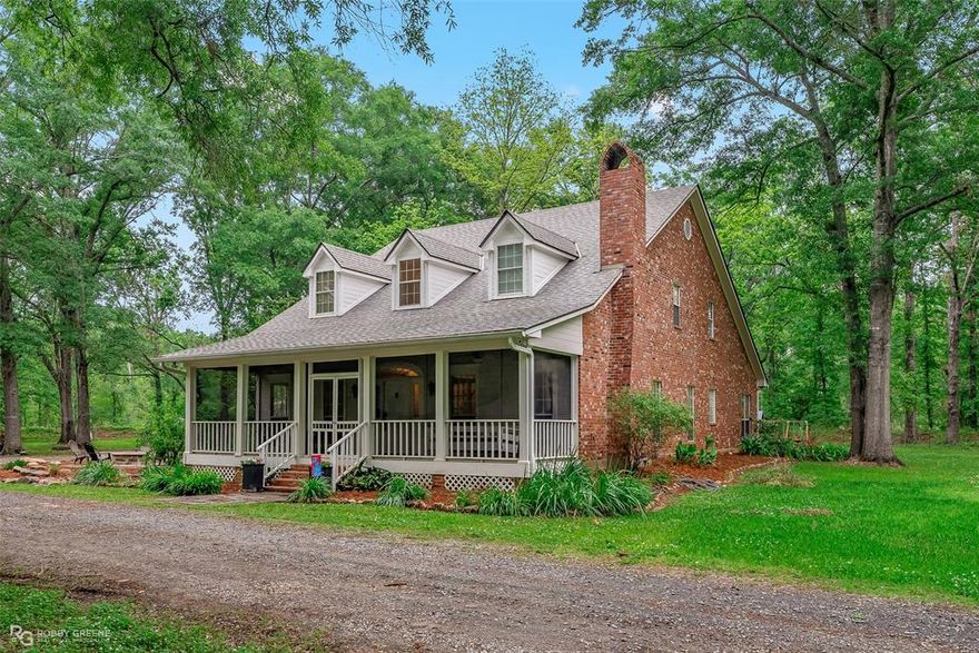 Open house postponed to Sunday May 19th.  Stunning Storybook Home on a secluded 5.35 Acre setting in South Bossier.  Newly installed wood tile flooring.  Updated bathrooms allow private access from each of the oversized 2nd floor bedrooms.. Large downstairs Office study could be 4th Bedroom.  Private Primary Bedroom suite located on the 1st floor.  Walk-in closet to each bedroom. Large screened in front porch equipped with a lazy front porch bed swing.  Acreage is fully fenced, and accesssed though the automatic electric wrought iron gate.