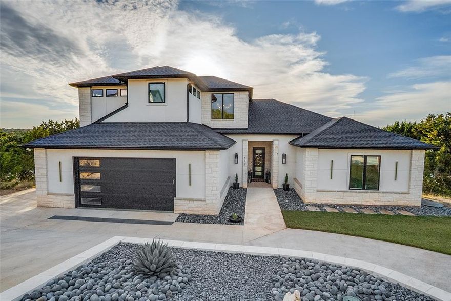 Nestled within the renowned Cliffs Resort development, overlooking the serene waters of Possum Kingdom Lake, this astounding residence is opulent living at its finest. Upon entering the front door, you are greeted by floor to ceiling windows overlooking deep waters of Neeley’s Slough and limestone cliffs blending into the horizon. Furnished, turn-key home boasts 4 bedrooms sleeping 14 comfortably, 4 bathrooms, 2 living areas, expansive outdoor entertaining areas, and sparkling pool. Owners’ suite, main living, kitchen, dining, guest bedroom, 3 full bathrooms, and laundry, are all on the ground level. Additional living area, 2 guest bedrooms, office nook, and 1 full bathroom are located upstairs. Boat slip is negotiable. Boat and golf cart are also for sale. Residents enjoy exclusive access to the on-site marina, boat ramp, 36 rounds of golf annually, pro-shop with golf simulator, restaurant, hotel, tennis courts, park, 24-7 security, fitness center, beach, & 2 additional pools.