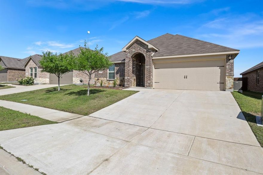 Fully furnished to skip the extra out-of-pocket costs and move in ready from day one. No waiting, no guesswork.Located in a rapidly expanding area of Ennis, this home offers a practical alternative to nearby new construction already complete, established, and ready for immediate use. Positioned just minutes from local junior high and high school campuses, the location supports efficient daily routines. Inside, the open concept layout connects the main living areas in a way that feels natural and functional. The kitchen is centered around a large island and features quartz countertops throughout, along with LED lighting that keeps the space bright. With four bedrooms and two full baths, the layout gives you options. Whether for guests, workspace, or future growing family needs. The covered patio adds usable outdoor space, and the full sprinkler system helps keep maintenance straightforward. A post-tension foundation contributes to the home’s overall construction design. Quick access to Interstate 45 keeps commuting to Dallas and surrounding areas simple, while nearby amenities and destinations like Lake Bardwell provide options for recreation.
If you’re weighing new construction versus resale, this home offers a combination of immediate availability, included value, and location that’s worth comparing. Schedule your showing and see the difference in person.