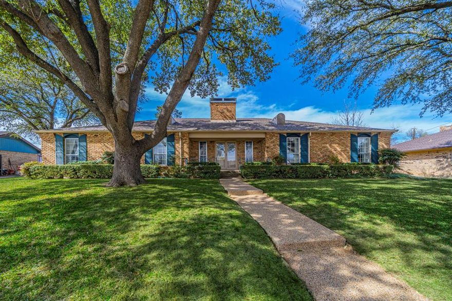Much-loved one-owner home is ready for the next era. Four bedrooms with walk-in closets; spacious formal living-dining room ideal for entertaining or as a flex space; very large second living area with wood-burning fireplace and a wall of built-in bookcases and doors leading out to the spacious covered back patio. The galley kitchen features loads of storage space and leads to the cheerful, sunlit breakfast room. The primary bedroom has enough space for a sitting area and is enhanced with abundant natural light. The primary bath has a tub-shower combination, single sink, and a wall of cabinets - again, loads of storage. The second full bath has a separate vanity and also serves as guest bath. An additional half-bath is located in the utility room between the kitchen and the garage. The spcaious rear-entry two-car garage includes a large additional space for work bench or storage. Plenty of extra parking in back; fenced yard with full sprinkler; quiet neighborhood with easy access to I-35, Loop 288, and shopping. Come make it yours!