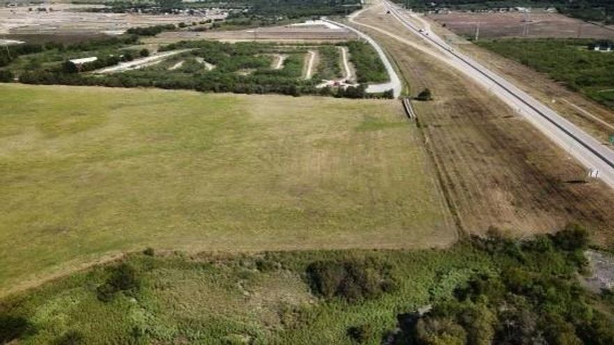 Introducing a prime 32 acre parcel with 894 feet of frontage along the prestigious Chisholm Trail Parkway, conveniently located on the Cleburne and Joshua border. The front 4.5 acres are nestled within the Cleburne city limits, providing unique development opportunities.This exceptionally level property is ideal for both commercial development and industrial use. Don't miss this rare chance to acquire a stunning piece of land with immense potential. Seize the opportunity today!