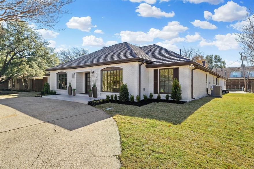 OPEN HOUSE Jan 17, 2 to 4pm and Jan 18, 1 to 4. Welcome to another thoughtfully executed renovation by TK Homes LLC, known for delivering elevated design, quality construction, and homes that truly live well. Located in one of the most desirable pockets near Preston Hollow, this residence has been fully reimagined with intention from the ground up.
The interior has been transformed with added square footage expanding the great room, all-new electrical and plumbing systems, two new HVAC units, a tankless water heater, and upgraded insulation throughout — creating a home that feels as solid as it is beautiful.
Curated finishes define the space, including engineered Mohawk Ridglea Isle Oak flooring, soft-close cabinetry, 3CM marble countertops, designer tile and lighting, polished chrome hardware, and frameless glass showers with dual showerheads. A custom trim package, solid-core doors, and a fresh Sherwin-Williams palette add warmth and refinement at every turn.

At the heart of the home is an exceptional double-island gourmet kitchen — a true centerpiece for gathering and entertaining — featuring a premium JennAir appliance suite, built-in microwave, and dual beverage refrigerators that balance high function with standout design.
The versatile floor plan offers two luxurious primary suites. The main suite includes a spa-inspired bath with dual showerheads, while a private secondary primary, thoughtfully set apart, also features an en suite bath with dual showerheads — ideal for guests or multigenerational living. A dedicated front office with an accent wall provides a stylish, quiet workspace.
Outdoor upgrades include fresh landscaping, an automated sprinkler system, salt-finish concrete patio, exterior lighting, epoxy-coated garage floor, and a gas line for grilling. Ideally located near top schools, shopping, dining, and major Dallas conveniences, this move-in-ready home offers a rare blend of modern luxury, proven craftsmanship, and lasting quality.