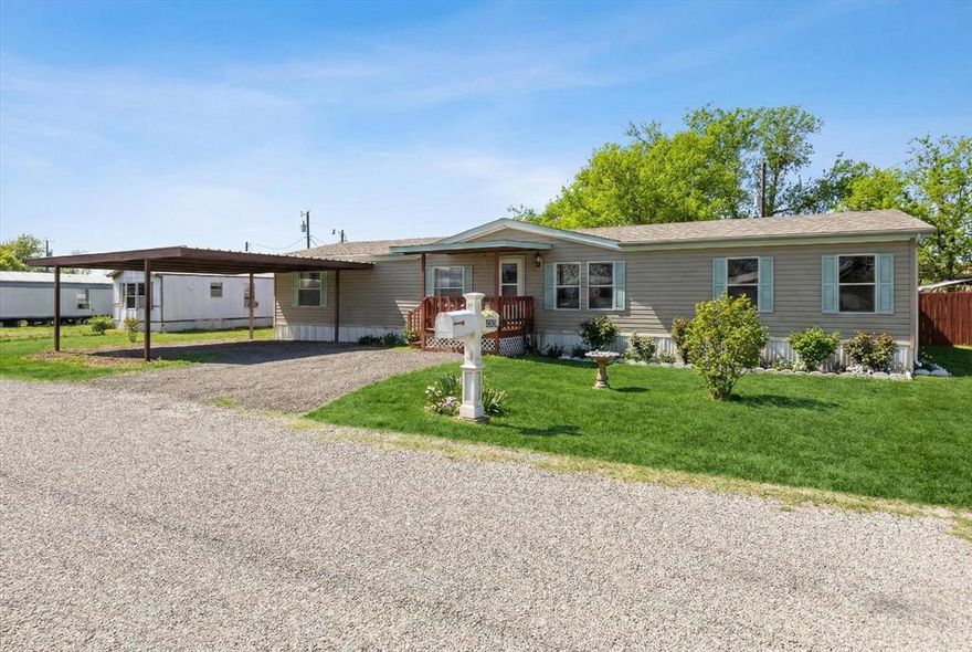 Charming 4-Bed Double-Wide on a Double Lot – Lake Granbury Access! Well-maintained and move-in ready, this beautiful 4-bedroom, 2-bathroom double-wide mobile home features a spacious open floor plan that's bright, airy, and perfect for relaxed living or entertaining.  Set on a generous double lot in a quiet, peaceful subdivision with Lake Granbury access—just a short walk to the neighborhood boat launch for easy boating, fishing, and lake enjoyment.  Pride of ownership shows throughout this very well taken care of home in a serene community. Ideal for year-round living or a peaceful lake getaway!Ready for its next owner—don't miss out!