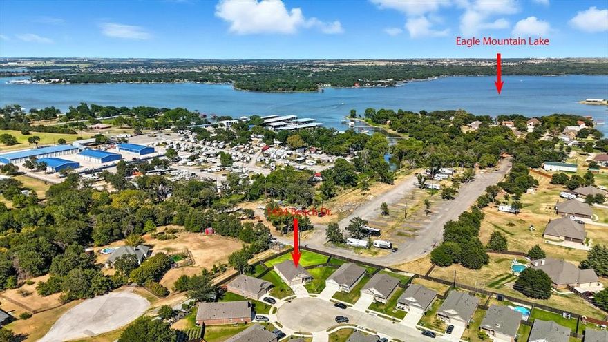 NEW ROOF!! LOW TAXES!! ***Additional incentives available, contact agent for more details***  PERFECTLY PRICED HOME! Welcome to 1404 Beach Drive, perfectly positioned by Eagle Mountain Lake and just moments from West Bay Marina and everyday conveniences! Whether you’re a boat owner, fishing enthusiast, or you just simply love lake life, this home offers the ultimate convenience with water access and recreation right outside your neighborhood. This 3-bedroom, 2-bathroom single story home sits on a private and on of the LARGEST lots in the community at the corner of a quiet cul-de-sac, giving you extra space and privacy rarely found at this price point. Upon entry to the home, you will have a covered front patio for afternoon or morning coffee and Inside, the open-concept layout seamlessly connects the kitchen, dining, and family room, creating an ideal setting for entertaining or relaxing with NO CARPET. Right off the kitchen is your direct access to the MASSIVE backyard, perfect for summer barbecues after a day on the lake, install your own private pool or create your own outdoor paradise and still have room left. This is a blank canvas where the possibilities are endless for you to do as you like. The privately situated owner’s suite features a walk-in closet and an ensuite bathroom with natural light, while two additional bedrooms offer versatility for family, guests, or a home office. A two-car garage provides ample parking and storage. Come tour this home near the water at an incredible value!