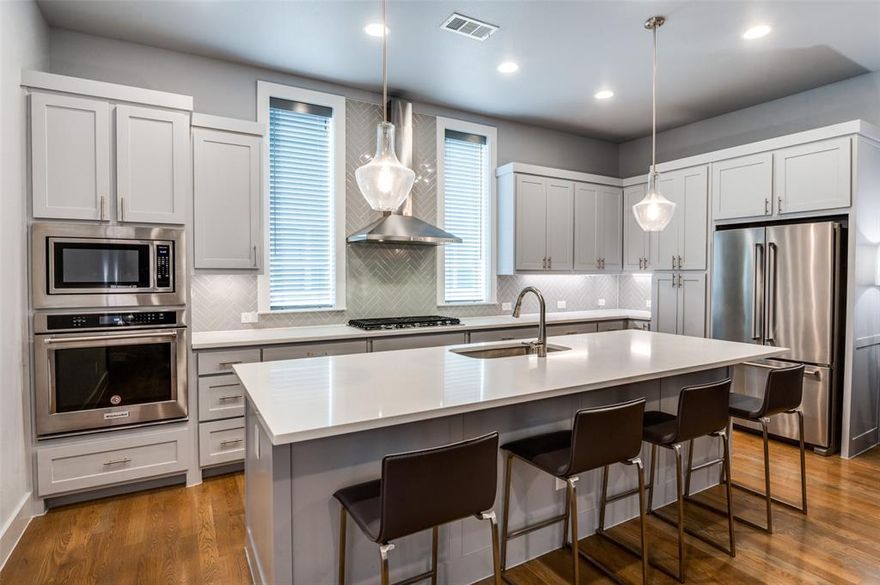 Modern Design Meets Urban Living in the Heart of Dallas! Welcome to 4776 Asher Place—an impeccably designed 2-bedroom, 2.5-bath contemporary townhome located in the gated Urban Place community just minutes from Lower Greenville, Deep Ellum, Uptown, and Downtown. This stylish 3-story home features clean architectural lines, high ceilings, and an open-concept layout ideal for entertaining.

The main living floor is filled with natural light and showcases hardwood floors, a sleek kitchen with quartz countertops, stainless steel appliances, and a large island with bar seating. Both bedrooms offer ensuite baths and modern finishes, while the spacious primary suite includes a spa-inspired bathroom and oversized shower.

Enjoy stunning Dallas views from your private rooftop deck—perfect for lounging or entertaining under the stars. Additional highlights include a tankless water heater, energy-efficient foam insulation, smart home wiring, and an attached two-car garage. HOA covers exterior maintenance, giving you low-maintenance, lock-and-leave convenience.

Don’t miss this opportunity to own a well-maintained home in one of Dallas’ most dynamic neighborhoods!