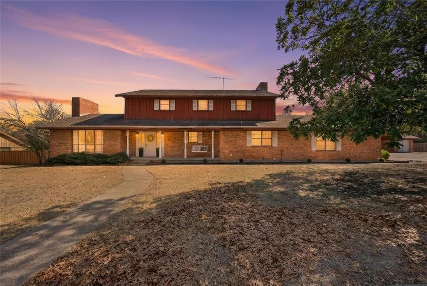 Welcome home to this spacious 5 bedroom, 3.5 bath residence that blends comfort, functionality, and timeless charm. Inside, you’ll find two generous living spaces, each featuring a cozy wood-burning fireplace, perfect for relaxing or entertaining. The eat in dining room offers a warm, inviting setting, while the sunlit office provides an ideal work from home retreat.

The home also boasts a recently updated large laundry or mud room, thoughtfully designed for everyday convenience. A private bedroom suite on the main floor adds flexibility for guests or multi generational living.

Upstairs, you’ll discover four additional bedrooms and two full bathrooms, including a very large primary suite with French doors opening to a balcony deck. Its a perfect spot to enjoy your morning coffee or unwind in the evening.

Situated on a huge lot with a beautiful yard, this property offers ample outdoor space to enjoy. A nicely sized garage is complemented by a separate brick carport that adds standout curb appeal, along with a small shop off the carport, ideal for lawn equipment or extra storage.

 This is a rare opportunity to own a home with space, character, and versatility on the inside and out.