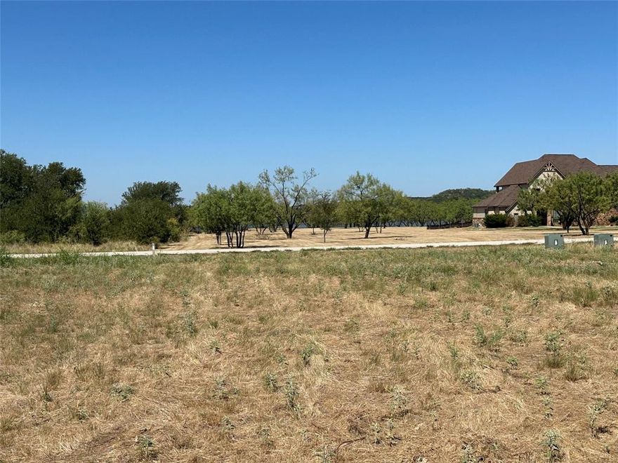 Very nice and level 1.23 acre lot across the street from Possum Kingdom Lake.