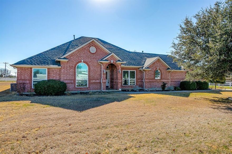 Discover the ideal balance of peaceful country living and modern comfort in this beautifully maintained single-story home, nestled on 2.828 acres within a sought-after gated equestrian community. Offering 2,674 sq. ft. of well-planned living space, this 4-bedroom, 2.5-bath home is designed for both relaxed daily living and effortless entertaining. At the center of the home, the spacious kitchen shines with a large island, granite countertops, custom cabinetry, and double ovens,perfect for everything from weeknight dinners to hosting guests. The open living area invites you in with a cozy gas fireplace and abundant space to gather. The private primary suite provides a true retreat, featuring a spa-like ensuite bath with a jetted garden tub, separate shower, dual sinks, and individual vanities for added comfort and convenience. For those seeking a true equestrian lifestyle, this property is ready to impress with a well-appointed barn offering two stalls and its own electric meter, a round pen, and fully fenced pasture. Enjoy direct access to scenic riding trails along with a lighted community arena for year-round use. Set outside city limits, this property delivers the tranquility and freedom of country living while still benefiting from the amenities and sense of community that make this neighborhood so desirable.