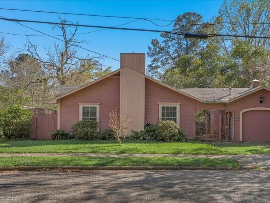 This beautifully maintained 3-bedroom, 2-bath home offers 1,979 square feet of timeless charm and thoughtful design. From the moment you enter, the living room welcomes you with a cedar closet, built-in shelving, a gas heater, and classic wallpaper trim with matching curtains that enhance the home’s character. The spacious primary suite features two closets and a private ensuite bathroom complete with a walk-in shower, Italian sink, and towel warmer. The second bedroom includes a walk-in closet and a built-in storage bench, surrounded by windows that provide peaceful views of the side yard, while the third bedroom offers built-in shelving and a generously sized closet. Additional highlights include a functional laundry room with a stackable washer and dryer and sink, and a secondary bathroom featuring a walk-in tub, marble surround tub, Italian toilet, and sink. The cozy den showcases a gas log fireplace with a blower, perfect for relaxing evenings. The dining room is surrounded by windows, allowing natural light and scenic views of the backyard. Major updates include a roof replacement in 2017, exterior paint in 2018, and new windows installed in 2012. Motion lights add extra convenience and security. Situated on a 0.1120-acre lot, this home has been exceptionally well cared for and is ready to be enjoyed by its next owner.