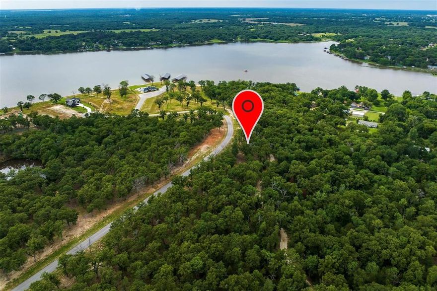 Build your dream home on this beautiful 1.63-acre elevated lot in the gated, master-planned community of Cedar Creek Ranch overlooking Cedar Creek Lake. This property includes deeded boat slip #30 and is conveniently located within walking distance to the clubhouse, community pool, and community boat slips. Cedar Creek Ranch is an upscale lake community featuring 82 homesites ranging from 1 to 6 acres, offering stunning rolling terrain, wide open spaces, and beautiful lake surroundings. Property owners enjoy access to a private boat launch for residents and guests, making it easy to enjoy boating, fishing, and lake living.Community amenities include a clubhouse, boat launch, community pool overlooking Cedar Creek Lake. Owners may bring the builder of their choice with a minimum of 1,600 square feet under HVAC for site-built homes must be approved by HOA ARC committee. Utilities include water provided by Lakeshore Water Company, electric through Trinity Valley Electric Cooperative, and septic system required, but not installed. Fencing is limited to iron, aluminum, or wood and may not exceed 5 feet in height. Rentals are allowed with a minimum of 3 days, unless otherwise approved by the HOA. Enjoy the perfect balance of peaceful acreage living and lake life in this exceptional community. Contact agent for additional information or to schedule a tour, appointment will be required community is gated!