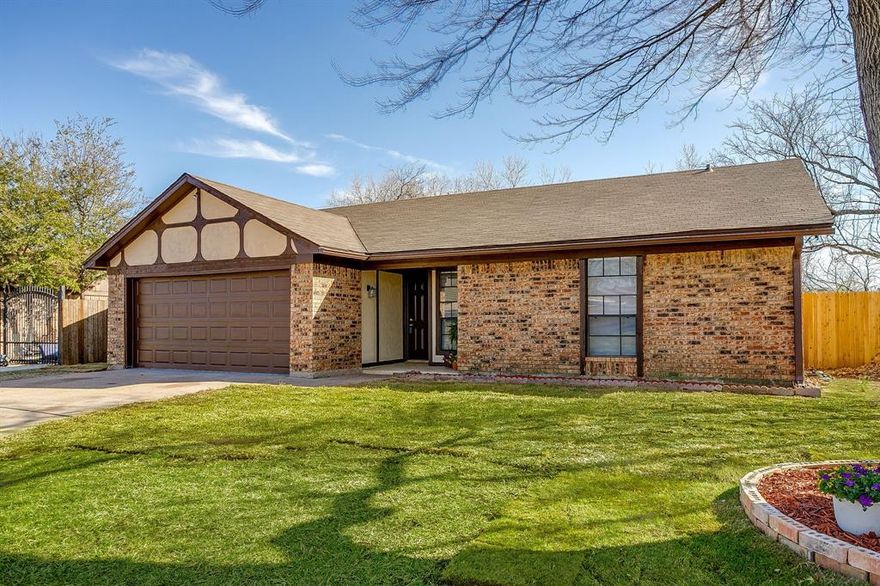 Seller offering up to $7,000 toward buyer closing costs or interest rate buy down. Step into modern sophistication and timeless comfort with this stunning, move-in-ready Benbrook gem, framed by a graceful large tree and updated landscaping! Extensively updated for 2026, this home has been meticulously curated to deliver a seamless, turn-key living experience. ELEGANT INTERIORS: The heart of the home is a light and bright kitchen designed for the culinary enthusiast, boasting sleek countertops and stainless steel appliances. The open-concept living space impresses with soaring vaulted ceilings, designer light fixtures, and a striking brick fireplace anchored by a classic white mantel. Throughout the home, a fresh neutral palette is complemented by luxury vinyl plank floors. PRIVATE RETREATS: Escape to the primary suite—a true sanctuary featuring an oversized bedroom and ensuite bath and a walk-in closet. Even the garage has been elevated, featuring fresh paint and a durable, professional finish. OUTDOOR OASIS: Rarely do you find this level of privacy; with no rear neighbors, your expansive backyard is a secluded paradise. Entertain in style on the covered patio all surrounded by a newer privacy fence. PRIME LOCATION:A commuter’s dream with effortless access to I-20, you’re also just minutes away from Benbrook’s premier golf courses, scenic parks, and bike trails.