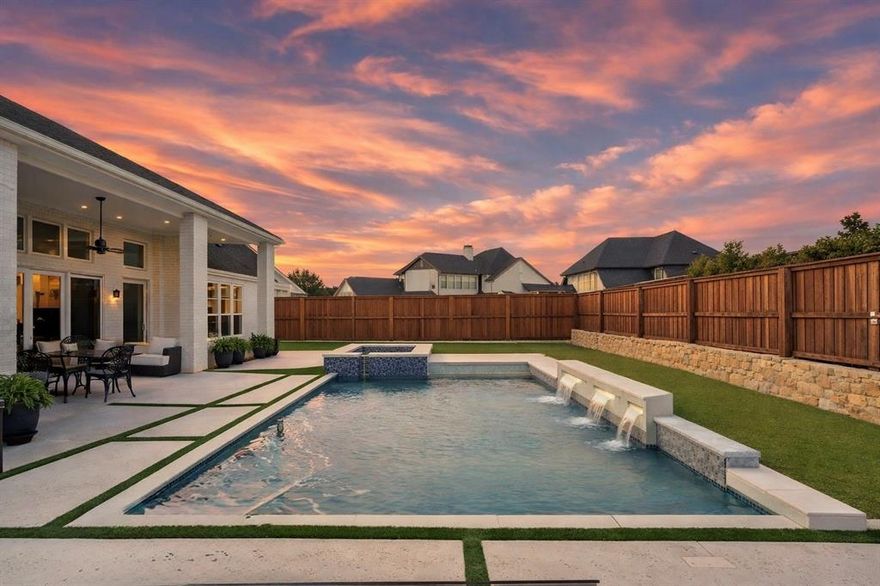 Price Improvement for this Like NEW located in the exclusive Peninsula of Windsong Ranch, this designer-upgraded home is built for ultimate relaxation and entertainment. The heart of the home features soaring ceilings, a stylish gas fireplace, and a Grand Chef’s Kitchen with an oversized working-butler’s pantry. Wine enthusiasts will love the dedicated wine room, perfectly positioned for hosting. The luxury continues outdoors with a Riverbend Sandler Pool, Spa, and outdoor kitchen. Inside, the layout offers a fully finished media room and upstairs bedrooms that each feature en-suite baths and walk-in closets. Every detail has been curated for an elevated living experience, featuring designer-selected lighting throughout that perfectly complements the home's aesthetic. High-end finishes include expansive sliding glass patio doors that merge indoor and outdoor living, sleek glass-enclosed showers, and durable epoxy flooring in garage. This massive 4.5-car garage provides a bump-out section for incredible storage. Living here means embracing the award-winning Windsong Ranch lifestyle, featuring the famous 5-acre Crystal Lagoon, resort-style pools, tennis, pickleball, and miles of scenic trails. Don’t miss your chance to own a piece of North Texas’s most sought-after community!