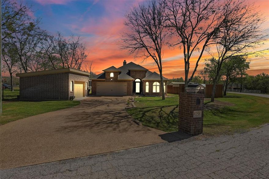 BRINGING SEXY BACK!!! Experience the perfect blend of peaceful country living and city convenience just minutes from Fort Worth and its vibrant dining, entertainment, and employment hubs. Located within highly sought-after Aledo Independent School District, this stunning, resort-style property has been meticulously maintained and thoughtfully designed for both everyday comfort and unforgettable entertaining.
From the moment you arrive, you’re welcomed by a grand wrought iron and glass entry door that makes a striking first impression. Inside, the home showcases granite countertops throughout, engineered wood and tile flooring, and an abundance of cabinet and closet space. Every detail reflects pride of ownership and quality craftsmanship.
Step outside to your private backyard retreat, complete with a sparkling pool, a spacious covered patio with outdoor kitchen, and a retractable screen enclosure for year round enjoyment. Mature trees surround the property, creating shade, privacy, and a serene atmosphere perfect for relaxing or hosting guests. Large pool deck area for laying out or having a party. 
This property is loaded with upgrades and functional features, including...
 18’ x 18’ climate-controlled brick workshop or second garage—ideal for hobbies, storage, or a man cave
 22’ x 36’ enclosed RV garage and workshop. Foam insulated. 
 Sprinkler system with drip irrigation for landscaped flower beds
 Rain gutters with leaf guards around the entire home
 3,000-gallon water storage tank with vinyl equipment shed, continuously supplied by the well
Whole-home water filtration system
Oversized wrought iron fenced backyard
 Auto-lighting in pantry, hallway, and primary closet
 Fireplace 
 Pool recently reconditioned and absolutely stunning.
Blending luxury, functionality, and a prime location near everything Fort Worth has to offer, this property delivers the best of both worlds—quiet rural charm & privacy with quick access to city amenities.