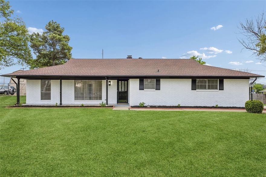 Discover this beautiful one-story brick mid-century modern home, ideally set on a spacious third-acre lot. Offering 4 bedrooms and 3 baths, the home features a thoughtfully designed layout with clean architectural lines, abundant natural light, and timeless design elements throughout. Open and inviting living areas create a seamless flow, well-suited for both everyday living and entertaining. Recent updates complement the home’s classic character while adding modern comfort and functionality. The formal living and dining areas provide excellent space for hosting, while the welcoming family room features a brick fireplace and connects effortlessly to the kitchen. The updated kitchen is designed with both style and convenience in mind, featuring a breakfast bar with seating, built-in appliances, designer lighting, and a bright breakfast nook. A versatile sunroom offers additional living space, ideal for relaxation, hobbies, or gatherings. Generously sized bedrooms and well-appointed bathrooms provide flexibility and privacy for a variety of needs. Outdoors, the expansive yard presents endless possibilities for recreation, gardening, or creating a personalized outdoor retreat. Ideally located with convenient access to parks, shopping, and dining, and centrally positioned between Dallas and Fort Worth, this home offers both comfort and accessibility. A rare opportunity to own a stylish mid-century modern residence on a large lot in a prime location. 3D tour available online!