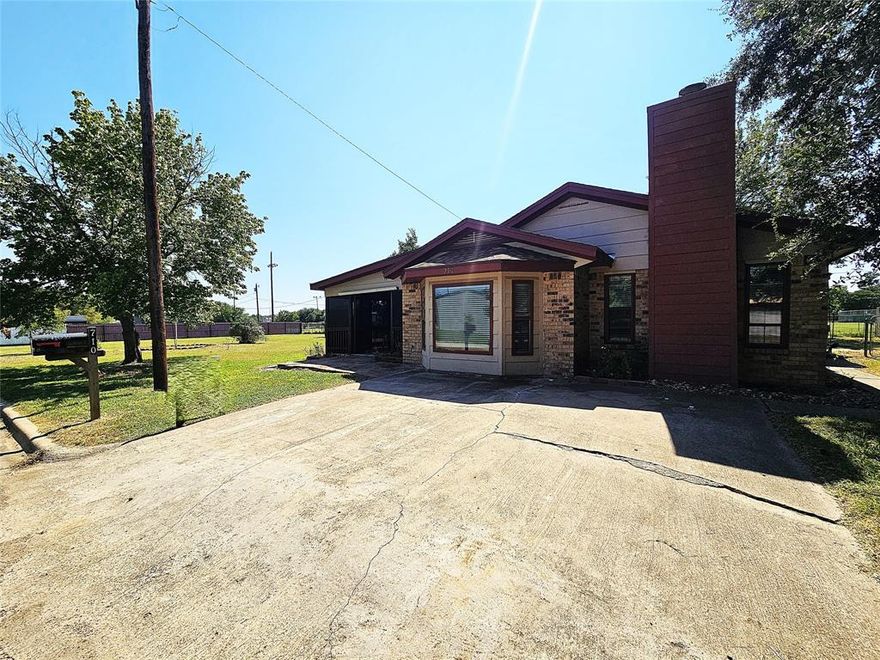 Location and Space!  Great brick home on multiple lots in a fantastic neighborhood in Groesbeck, Texas.  Home features 1,857 square feet, 3 bedrooms and 2 bathrooms, oversized living room with wood burning fireplace, dining area, cute kitchen with nice-sized utility room.  Almost all solid surface flooring and a walk in shower in the master bathroom.  Oversized screened in patio makes for an awesome additional entertaining space.  Home is on 3 lots, and exterior features include a large storage shed, some fencing, and lots of space for a shop, additional home, pool, garden or whatever you might need.