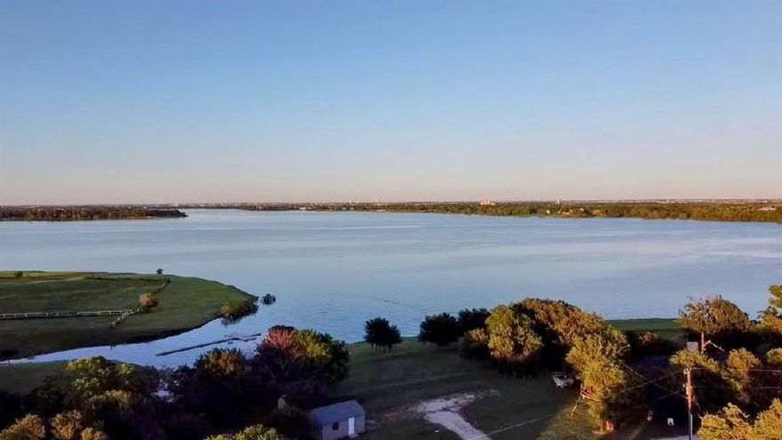 Rare lakefront lot in unincorporated area of Little Elm giving you more freedom with the type of property you build. Whether it be full time living, a vacation home, or income property that you use for long term or short term rentals, this serene lakefront property is a stunner! Live almost off the grid with your own well and septic systems. Due to the requirement for personal uitilities, lot will be suitable for approximately 2500 sq feet or less. Seller's have begun the permitting process and have plans for a three story home. Use their plans, or your own. Because this property is not within the city limits, you will have one of the lowest tax bases in Denton County. Property currently has a garage and storage shed. Leave a couple kayaks and some chairs on site and spend the day envisioning what you want to build. The gentle slope and deep water make this a perfect spot for boating, paddleboarding, swimming or fishing. While the property feels like you're out in the country, you are minutes away from shopping, restaurants, and major thouroughfares. There are not many  lots like this left in the Dallas Metroplex to build what you desire. Don't miss out!