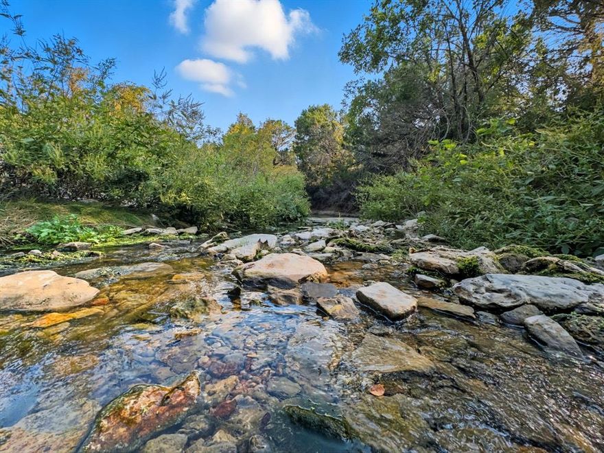 The Hamilton Creek Ranch: 184 Acres with Nearly a Mile of Live Water!
Discover a truly exceptional and rare opportunity to own a working and recreational ranch just 10 minutes from downtown Hamilton, Texas. This highly diverse 184 ± acre property boasts extensive live water, income potential, and unmatched hunting.

The cornerstone of this ranch is its incredible water and land assets: Enjoy approximately 4,686 feet of year-round Pecan Creek frontage combined with Two Mile Creek—nearly a full mile of permanent water sources, essential for wildlife and recreation. Includes 45 ± acres of cultivated land for farming, hay production, or food plots. Features 3,770 ± feet of county road frontage for easy access and potential future division. Rolling acreage with nice elevation changes provides diverse topography and excellent views.

With abundant water and diversified habitat, this ranch is a proven Central Texas hunting destination: Prime habitat supporting Whitetail Deer, Turkey, and Dove hunting. The land offers great cover for wildlife, ensuring strong populations and a premier hunting experience.

The property includes existing structures that offer immediate utility and flexibility: A rental house on the property provides immediate monthly income or comfortable accommodations for a ranch foreman or guests. A one-room quaint cabin offers a rustic hunting camp or a peaceful weekend getaway retreat. A small shop provides secure storage for equipment and tools.

This Hamilton County ranch represents a perfect blend of recreational paradise, agricultural functionality, and easy-access country living. Whether you seek a turnkey hunting operation, an agricultural investment, or a future family legacy, this property checks every box. Schedule your private showing today!