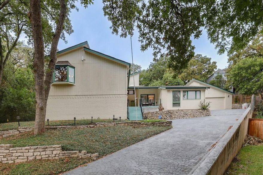 Nestled on a quiet court in North Arlington, this impressive 3,807-square-foot home offers six spacious bedrooms and four bathrooms—perfect for families needing plenty of room. The home features desirable upgrades including wood flooring in select areas and updated windows. Step onto the charming front porch complete with a swing, then inside to discover a spacious dining room adorned with wood floors and plantation shutters—ideal for elegant entertaining. The expansive living room showcases a stone wood-burning fireplace, Bose surround sound, and a large built-in bookcase, creating a cozy library atmosphere. A spiral staircase leads to a unique loft retreat above. The kitchen comes equipped with standard appliances, a double oven, and elegant marble countertops. The generously sized laundry room includes a sink, ample cabinetry, storage space, and a folding table for added convenience. The primary bedroom is truly expansive, featuring a modernized en-suite bathroom with a double closet, separate shower, jetted tub, dual vanities, and a skylight that fills the space with natural light. Outside, enjoy your private backyard oasis with a swimming pool and hot tub. A Generac generator backed by two 80-gallon propane tanks provides reliable backup power and peace of mind. 3-car garage total: attached 2-car garage + attached 1-car garage, offering abundant parking and storage options. This home perfectly combines serene surroundings with convenient access to local schools, parks, shopping, and dining—offering both tranquility and functionality for your lifestyle.