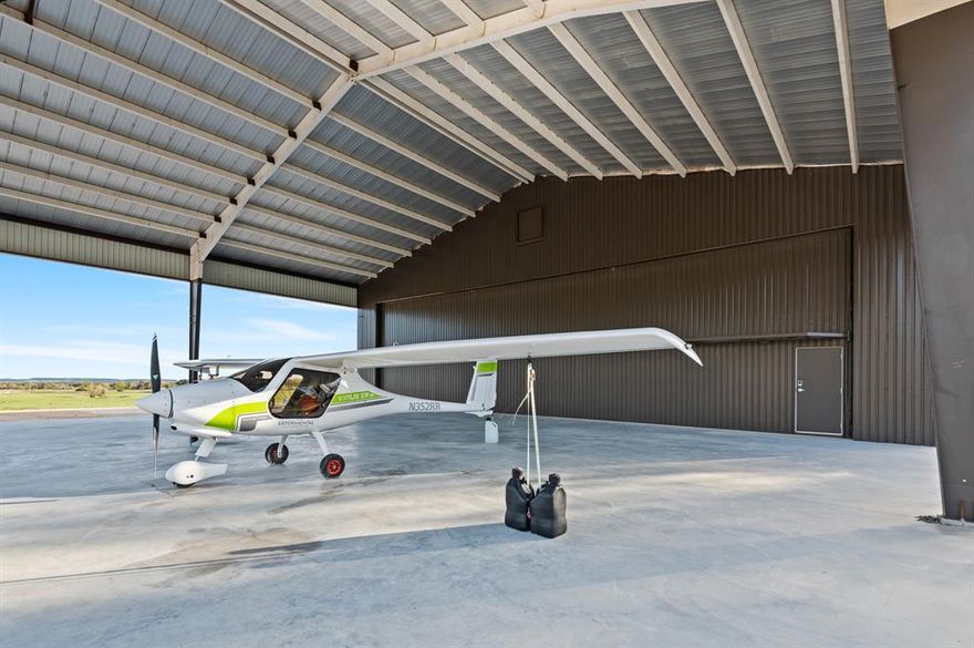 MULTI-USE LUXURY HANGAR-RESIDENCE, 4,700 SQFT, STORM SHELTER, HIGH-SECURITY AMENITIES, FULL BATH - KITCHENETTE, BATTERY GAS STOVE, 8,000 SQFT SHOP, COVERED AIRPLANE HANGAR, FLY-IN COMMUNITY DEV POTENTIAL, NEW 3,000' AIRSTRIP, PRIME LOCATION EAST OF LOMETA, ABUNDANT WILDLIFE, WHITETAIL DEER, WILD TURKEYS, FENCED & CROSS-FENCED, ALL-WEATHER RANCH ROADS, 2,500' RD FRONTAGE FM 581, SWEEPING VIEWS, 180' ELEVATION CHANGE