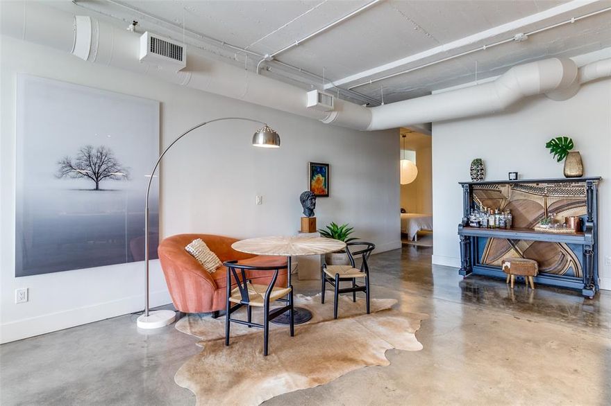 This Stylish 1bed, 1bath condo is located in the heart of Downtown Dallas and is move in ready! This unit features 1411 sf, a spacious layout including soaring ceilings, exposed brick and breathtaking views of the iconic Reunion Tower and Omni Hotel and expansive floor to ceiling windows with new solar blinds. Upon entry, be greeted by a stylish BR accentuated with custom closet space ensuring all your belongings are neatly arranged and easily accessible. Enter into your large living space with a cozy sitting area and a picturesque backdrop of downtown every day from the comfort of your living room.  The unique metal divider is very versatile for creating additional space for either a personal workout area or another sleeping area. The kitchen is equipped with SS appliances (all new Feb 2022), granite counter tops and a kitchen eat-in island, combining style and functionality! The fabulously renovated large bathroom boasts custom vanity and shelve upgrades and a spacious custom walk in shower, creating a refreshing space for your daily routine. Additional upgrades include the HVAC unit, Polished Concrete flooring, Light Fixtures, Fans, and New Paint throughout the condo. Residents can take advantage of 24 hr security, sparkling rooftop pool on the 11th floor with outdoor seating area with grill and a fully equipped gym on the second floor. Two tandem parking spaces are included. Located within walking distance of the AT&T Discovery District and Exchange, you’ll have easy access to dining, entertainment, and cultural attractions. HOA includes internet, water, trash and sewer.