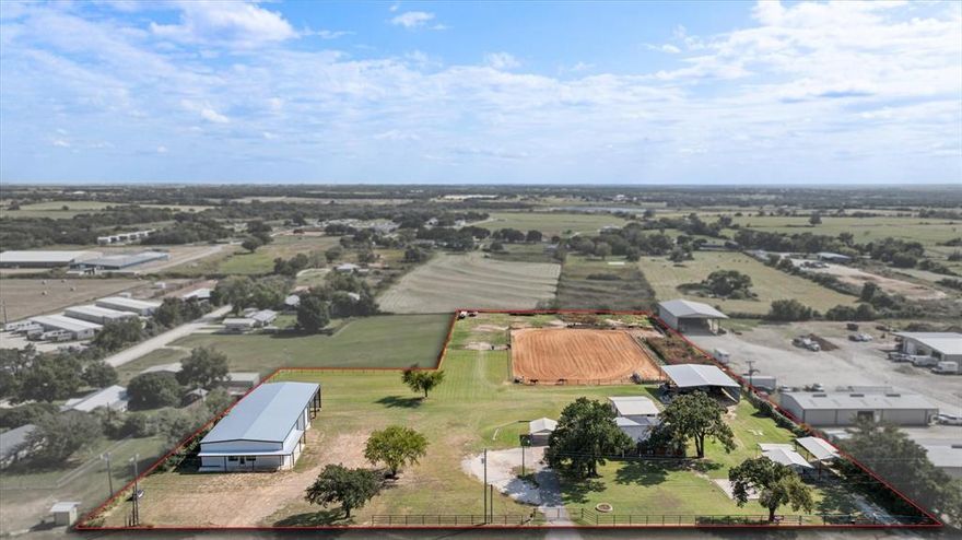 This stunning 5.1 acre property has a multitude of possibilities with a charming 3 bedroom and 2 bathroom house. The house has been newly remodeled with beautiful granite countertops and lovely two-toned farmhouse style kitchen cabinets. Both bathrooms are spacious with walk in showers and plenty of countertop space. Quaint breakfast nook as well as an air-conditioned sunroom both with lots of natural light and a perfect view of the arena. Arena is equipped with roping boxes and chute as well as a couple of nice size traps for horses and cattle. Just above the arena is 50 ft by 60 ft equipment barn that could house equipment, hay and feed or easily be converted into a horse barn. There is also a 40 ft by 40 ft building that is currently be used as a tack room plus well house. Towards the front of the house to the right is a small rustic building with lots of potiential and a metal shed tall enough to park a trailer or RV. To the left of the front of the house is a 50 ft by 120 ft shop building with two large bays in the back and loading dock. The highway frontage of this property would make this perfect to have your business in or rent it out to another business and have the convenience of managing everything right in your own backyard. Either way you look at this entire property it has great potential to be an income driven home. Schedule a time with me and let's go take a look at your next dream property.