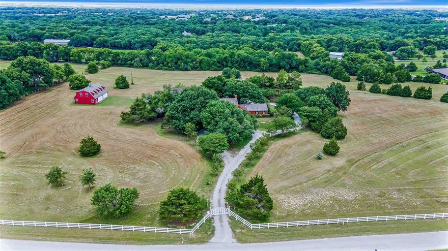 Rare Opportunity! Imagine a Beautiful Home on a Hill overlooking 13 Ac, with a White Electric Gate. 2.7 Miles from Lake Lavon. Surrounded with homes that have Horses, Cattle, etc. One owner since 1973. 4 Tracts being sold as one property and totalling 13.26 acres. This is a 2 story home with 4 bedrooms, 3 full baths, 2 Car Attached Garage, and a 2 story barn. The home has updated kitchen and baths. Large Verandah off the Primary Bedroom upstairs. Kitchen has Two Convection Ovens. Large Laundry Room off Kitchen with storage closets. Attached Garage with 8x9 storage attached. The barn is unfinished and plumbed for water and electricity, but not connected. The upstairs of the barn has great potential. It could be finished out to be a fabulous guest house. The barn has 2 Double Car Garage Doors and a concrete floor. City Water and Septic System. 2 Water Heaters (Hall & Garage), HVAC (Downstairs 2011, Upstairs 2020), Replaced Handler 2023, Septic Pumped in 2011. Room for a Pool and Pond in the back. Must See!