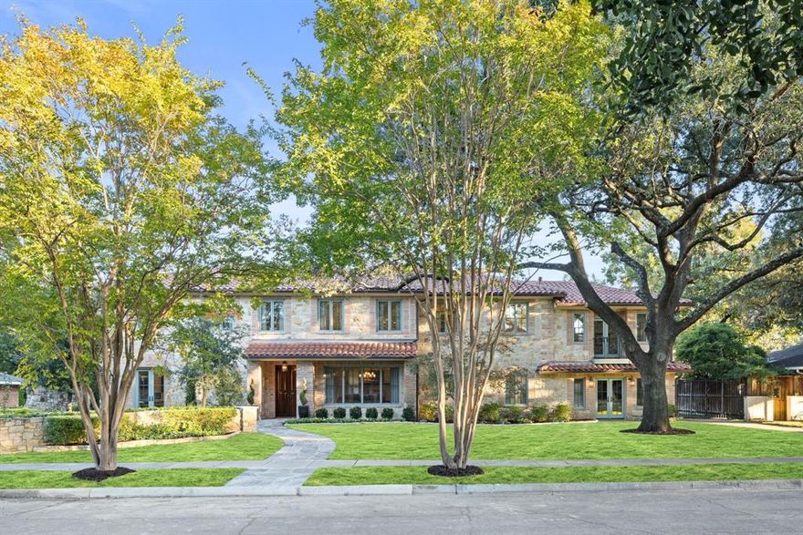 Tucked away on a peaceful block in Lakewood steps from White Rock Lake, this exceptionally renovated home embodies a seamless blend of timeless character and quiet luxury. Every detail has been thoughtfully curated, with meticulous designer finishes, fixtures and impeccable craftsmanship defining each space. The main house offers four generous bedrooms, including two serene primary suites, one downstairs and one up, along with multiple living and dining areas, a refined study, a game room with a wet bar, and a charming playroom. At the heart of the home, the chef’s kitchen captivates with a custom walnut island, butler’s pantry, built-in breakfast banquette, and top-tier appliances. Outside, lush landscaping frames a private backyard retreat featuring a sparkling pool, living area with built-in grill, and a 480-square-foot two bedroom guest house perfectly suited for visitors or extended stays. Additional highlights include two powder baths, custom window treatments, recent professional landscaping, updated HVAC systems, two-car garage, a stylish utility room, and dual staircases. Fully reimagined with an eye for design and livability, this Lakewood gem offers a rare harmony of elegance, space, comfort, and craftsmanship.