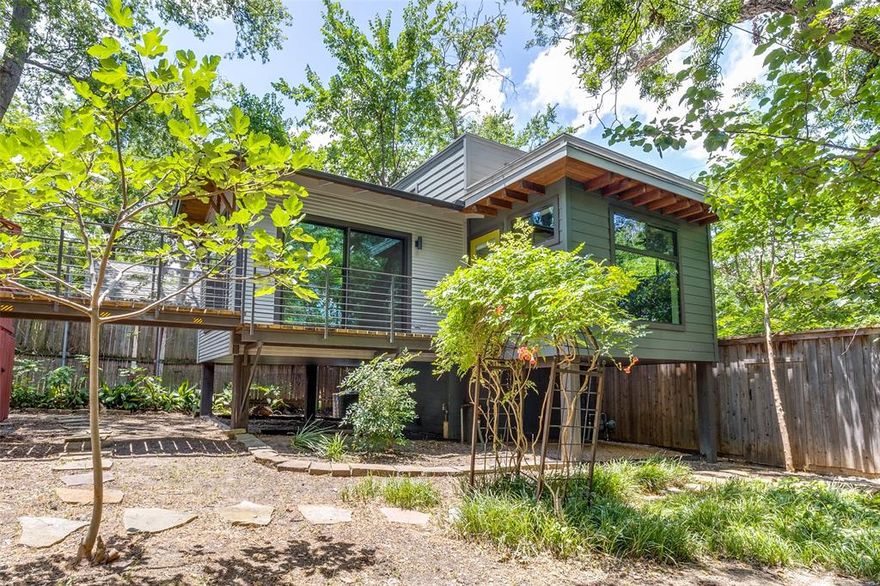 Discover exceptional value in the highly sought-after Hollywood Heights neighborhood with this rare opportunity offering 2,284 sq. ft. of total living space, including a separate 440 sq. ft. guest house—ideal for rental income, multi-generational living, office space, or a private retreat.

Affectionately known as The Tree House, the guest residence was designed by Brian Gream in 2017 and offers a one-of-a-kind living experience, elevated above the lot and accessed by a charming bridge from the back deck.

The main home blends 1930s character with functional living, featuring a spacious front porch, sun-filled interiors with walls of windows, original hardwood floors, vintage stained-glass cabinetry, and generous bedrooms with walk-in closets. The open-concept dining and living spaces flow seamlessly to the rear deck, creating inviting indoor-outdoor living perfect for entertaining.

With updates, this property has the potential to become a true million-dollar home in one of Dallas’ most cherished neighborhoods. Enjoy proximity to White Rock Lake, Lakewood shopping and dining, Baylor Medical District, Lakewood Country Club, and top-rated Lakewood Elementary, with easy access to downtown and major highways.

A unique property offering lifestyle, location, and investment potential—all in one.